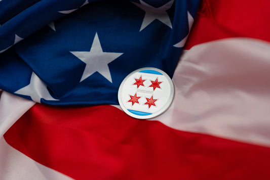 Abbott World Marathon Majors Chicago collectible coin with four red stars displayed on an American flag background