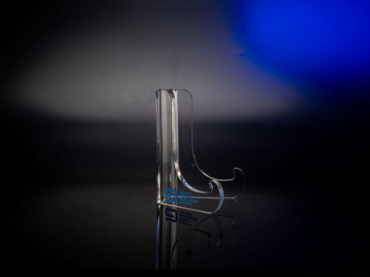 Clear acrylic display stand shown from a side angle with curved base supports and the Abbott World Marathon Majors logo, photographed against a dark backdrop with blue lighting.